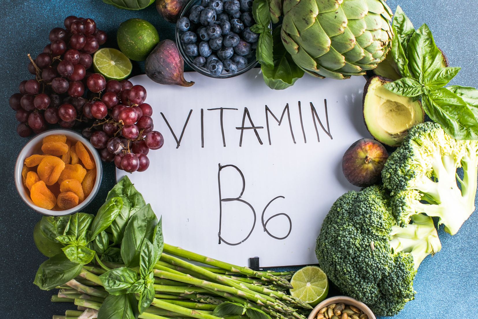 Fruits and vegetables arranged around a Vitamin B6 sign