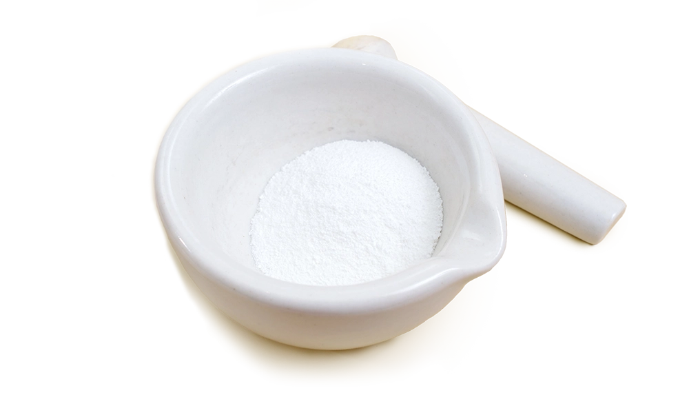 White mortar and pestle with L-arginine powder