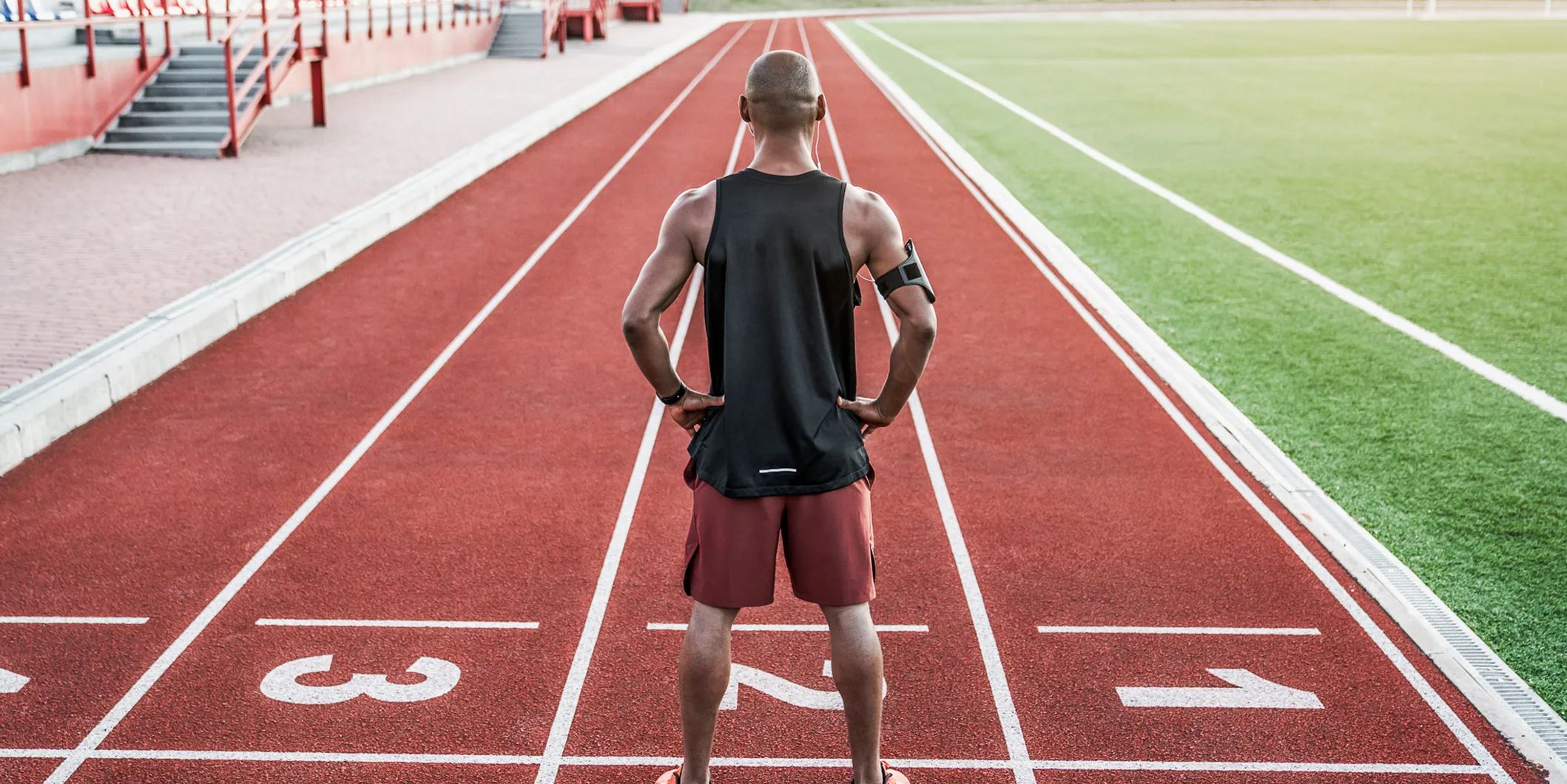Man standing on a running track